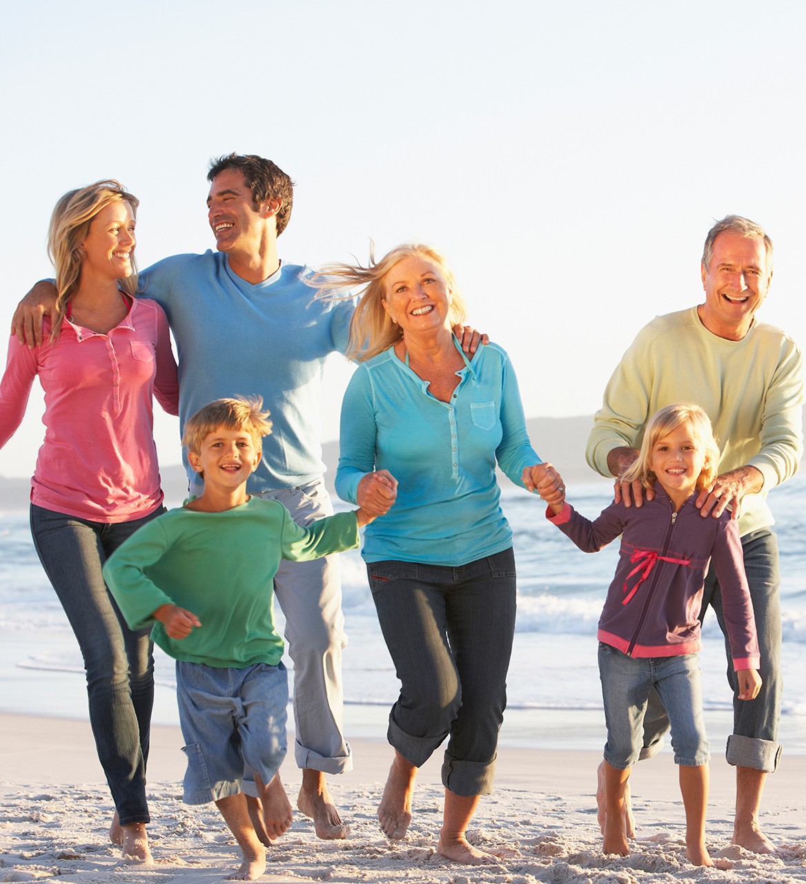 running family on beach